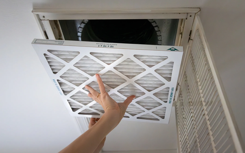 Dusty air duct interior before professional cleaning